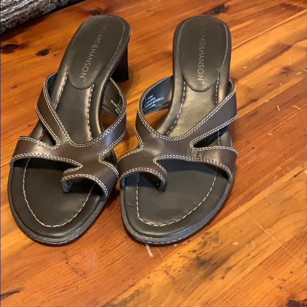 Brown heeled sandals.